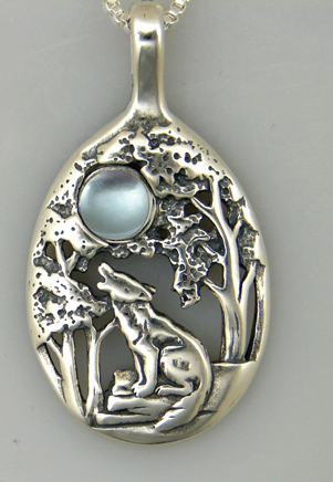 Sterling Silver Howling Wolf Pendant With Blue Topaz